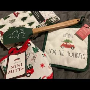 Holiday kitchen collection: napkins, hot pad and spatula, and oven mitts.